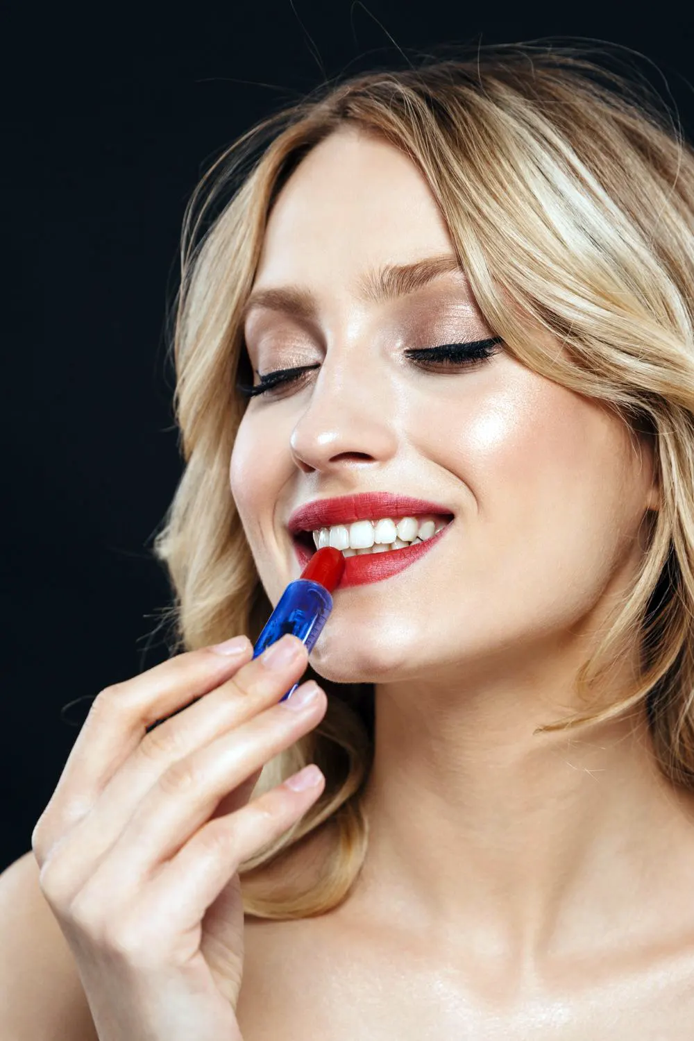 Woman Applying Lipstick