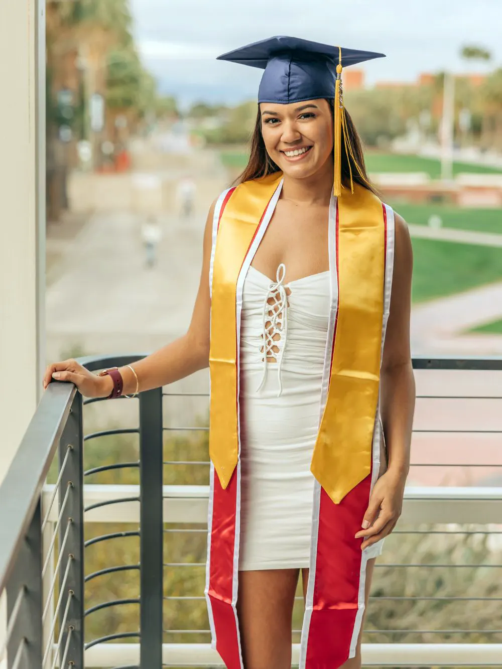 Girl wearing a white dress on graduation