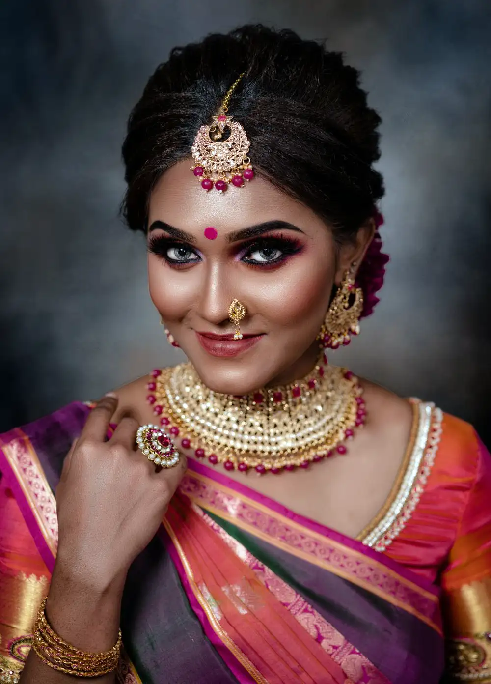 Beautiful Young Woman in Traditional Clothing and Jewellery with Bindi