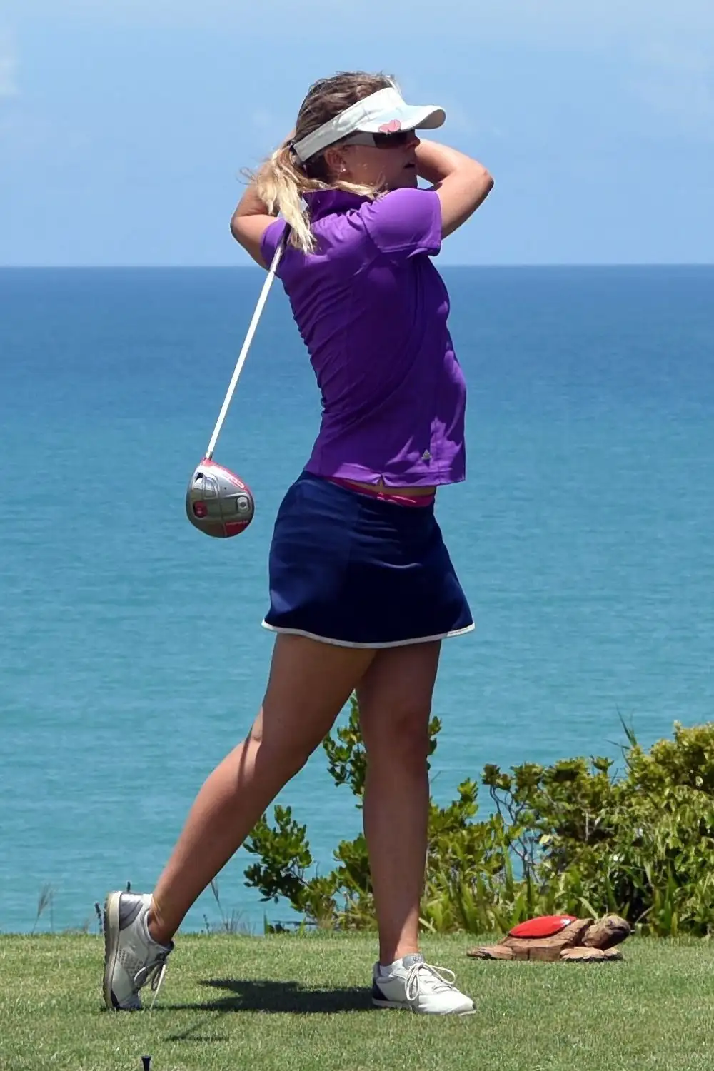 Female Golfer in Short Skirt