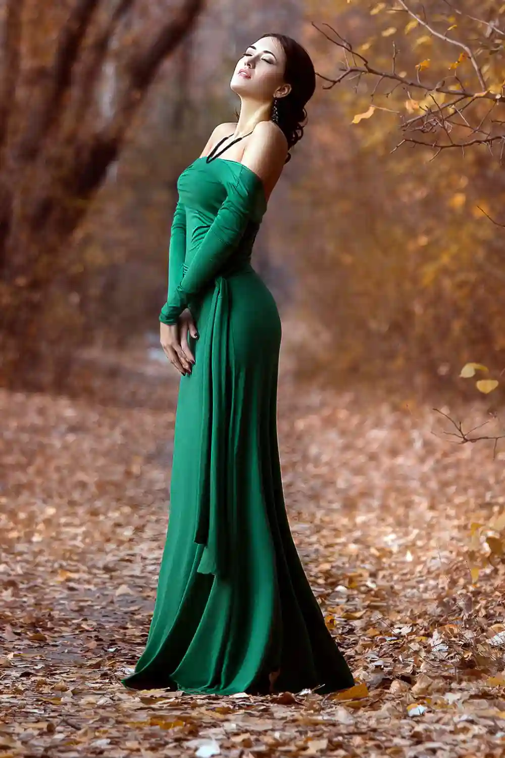 Lady in a luxury lush emerald green dress