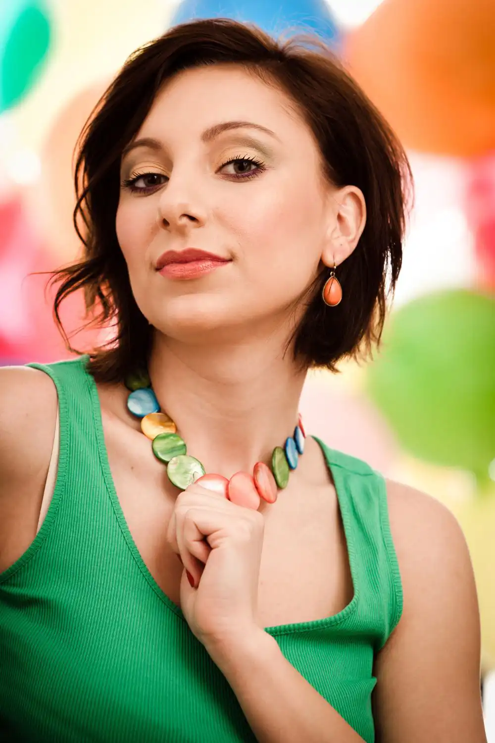 woman holding her colored necklace