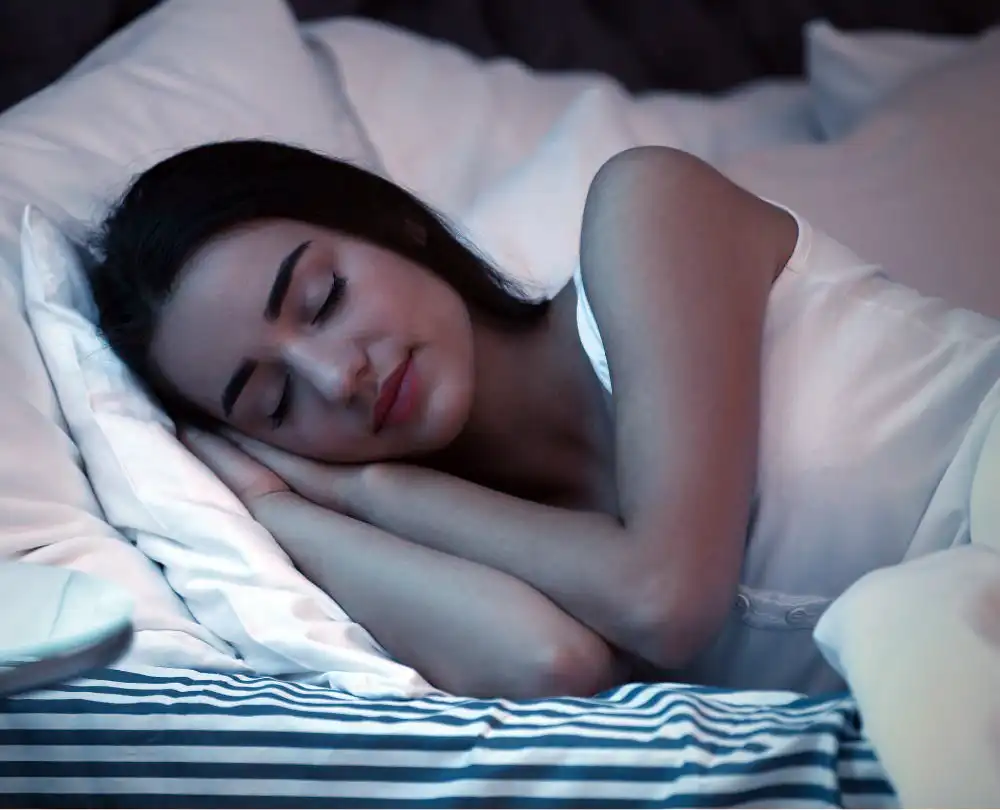 Young Woman Sleeping in Bed